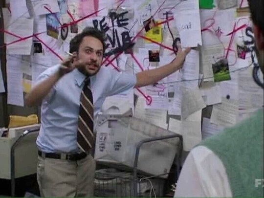 Charlie Kelly tries to explain a wall of papers connected by red string.